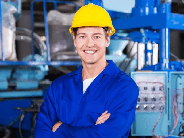 Service technician with arms crossed and smiling.